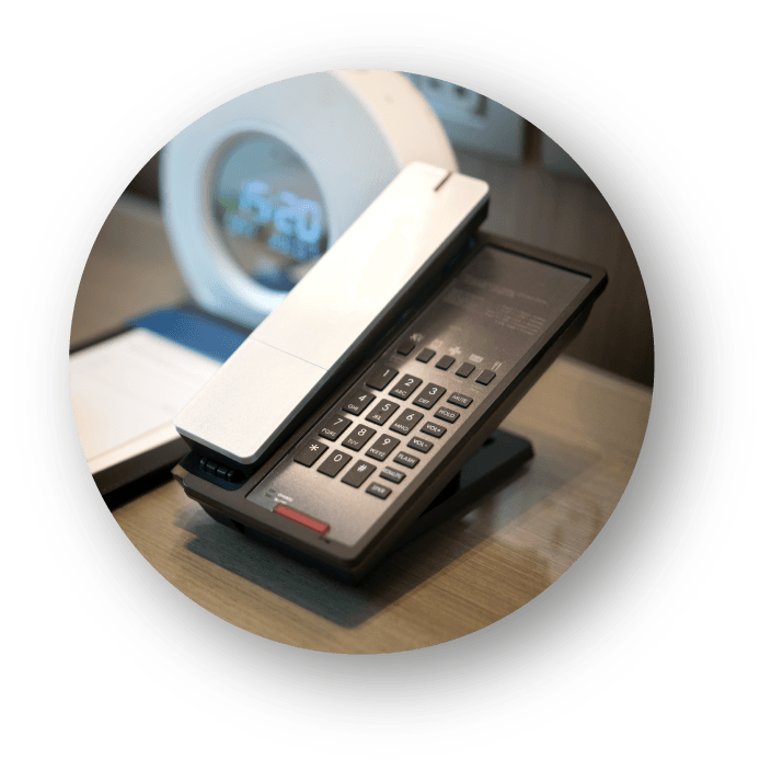 Familiar desk telephone connected through HotelGenie Voice Bridge